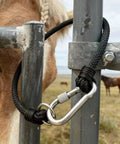 Straight Up Heavy Duty Horse Gate Latch With Rust Resistant Nylon Steel Tie Rope For Secure Barn Fence Fastening And Dependable Outdoor Livestock Herd Gear on a gate.