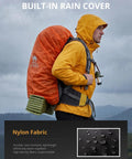 Person hiking with 65L Internal Frame Hiking Backpack With Rain Cover For Camping, Waterproof Daypack in rain.