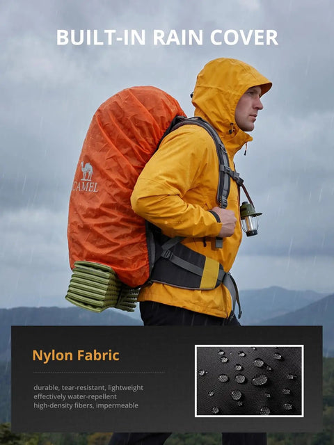 Person hiking with 65L Internal Frame Hiking Backpack With Rain Cover For Camping, Waterproof Daypack in rain.