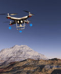Flying drone in mountain landscape, not Three Set RC Helicopter Training Gear Kit With Blue Frame And Sponge Ball Practice Balls.