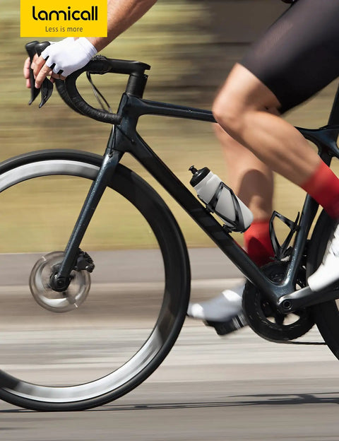 Cyclist using Ultralight Bike Water Bottle Holder For 2.75 To 3.94 Inch Bottles With Durable Cup Cage And Screw Tool during ride