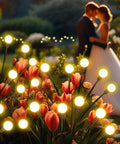 Solar Garden Lights Outdoor 4 Pack Swaying LED Fairy Lights glowing among flowers at sunset, enhancing a romantic garden atmosphere.