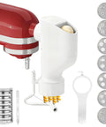 All In One Pasta Press Attachment For Stand Mixers With 7 Interchangeable Plates and dough extruding from mixer