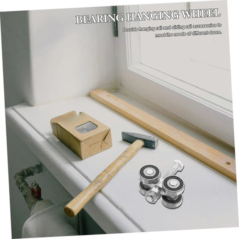 Heavy Duty Double Bearing Sliding Door Pulley Kit parts including stainless steel wheels on a workbench with tools.