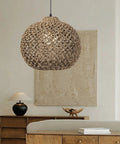 One Light Rattan Woven Pendant Light Fixture With Handwoven Lampshade shown in a modern living room setting