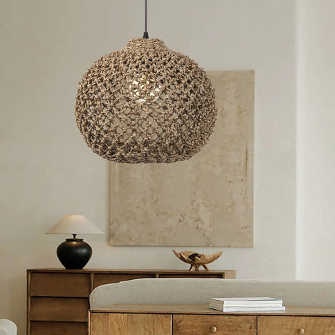 One Light Rattan Woven Pendant Light Fixture With Handwoven Lampshade shown in a modern living room setting