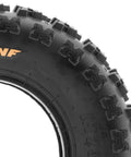 Close-up of Knobby Sport ATV UTV Tires 22x7-10 Tubeless A027 6 Ply Set Of 2 showing tread pattern and sidewall details.