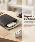 100 Pack 5 By 6 Inch Black Poly Bubble Mailers Self Seal Padded Envelopes on a desk with mail items visible