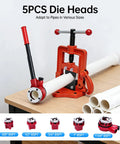 Heavy Duty Ratchet Pipe Threader Kit With Five Swappable Die Heads For Galvanized And Steel Tubing built on a workbench with die sizes.