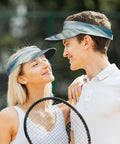 Couple wearing Open Top Sun Visor Hat For Outdoor Sports, Ventilated UV Protection Visor With Curved Brim, smiling at each other