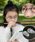 Girl wearing glasses with Five Pairs Silicone Eyeglass Nose Pads With Air Chamber All-Day Comfort, close-up of nose pads and lenses.