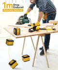 Man using power saw on wooden table with drop-resistant laser level visible, highlighting durability and accuracy assurances.
