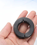 Two Piece Single Split Shaft Collar One And One Eighth Inch Bore One And Seven Eighths Inch Outer Diameter Half Inch Thick Black Oxide Lock Collar With Set Screws 1045 Steel Heavy Duty Clamping Collar For Machinery held in hand