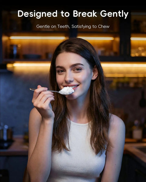 Woman enjoying nugget ice from Nugget Ice Maker With Touchless Dispenser For Home And Office Use in a kitchen setting.
