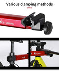 Close-up of Bike Repair Stand With 360 Degree Swivel Clamp Adjustable Foldable Work Stand Lightweight Aluminum Floor Station 85 Lbs Max Capacity Tripod Base Quick Release Perfect For DIY Home Mechanics clamping methods.