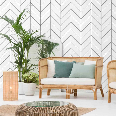 Black And White Peel And Stick Wallpaper For Easy DIY Decor, Modern Striped Geometric Herringbone Self Adhesive Removable Contact Paper For Walls And Furniture, 17.71 By 118 Inches, Great For Home Renovation Projects decorating a living room wall with plants and rattan furniture.