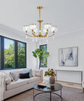 Gold Wagon Wheel Chandelier With 6 Lights, Clear Crystal Shades, in living room setting, Nordic Modern Mid Century Hanging Pendant Light Fixture