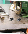4 Pack Shock Absorber Mounts For Isolation Of Fitness Equipment Quiet Vibration Damping Isolators with bolts on a workshop table