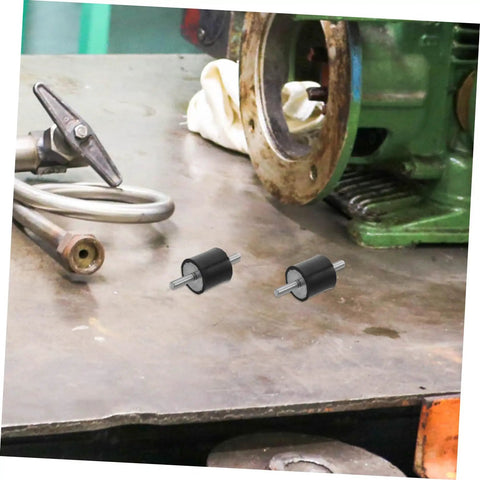 4 Pack Shock Absorber Mounts For Isolation Of Fitness Equipment Quiet Vibration Damping Isolators with bolts on a workshop table