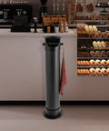 Espresso Knock Box for Home and Pro Cafes, Floor Standing Coffee Grounds Dump Bin with Anti Splash Deep Bowl in a cafe setting