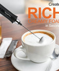 3-In-1 No-Fuss Rechargeable Milk Frother Handheld Foam Maker creating creamy foam in a cup of coffee on a table