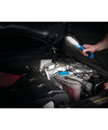 Person using 1000 Lumen LED Drop Light With Built In 120V Outlet under car hood for inspection