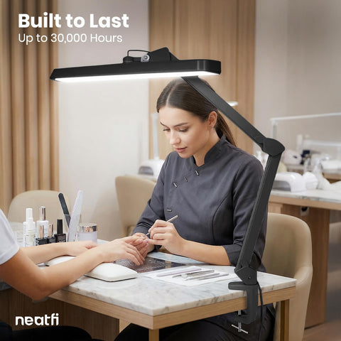 Woman using Ultra Bright 2500 Lumen LED Task Lamp With 22 Inch Wide Shade for nail tables, eye caring 6500K daylight.