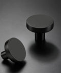 Top Tier Heavy Duty Black Cabinet Knobs Slick Round Handles For Kitchen Cupboards And Drawers Solid Zinc Alloy Hardware Built Tough Quick Install Hassle Free Setup Dependable Twenty Pack Bundle with a flat round surface.