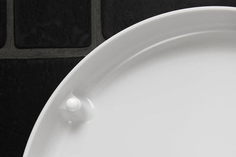 Close-up of Slick Starck 3 White Toilet Seat surface showing smooth finish and hinge attachment for easy installation.