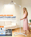 Woman standing next to Lash Light Half Moon Magnifying Desk Lamp With 10X Optical Glass, demonstrating wheeled floor lamp design.