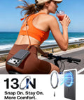 Woman biking by the ocean with Straight Up Top Shelf MagSafe Power Bank attached, showcasing secure magnetic snap and slim design.