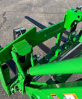 Close-up view of No Hassle Dual Mount Tractor Pallet Forks For Front Loader And Three Point Hitch in bright green finish.