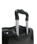 Handle and wheels of kids dinosaur carry on luggage, close-up view
