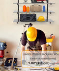 Worker in a workshop with Beefy 9 Level Wall Mount Wood Storage Rack, 1080 lb capacity, orange brackets, and shelves in background