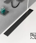 32 Inch Linear Shower Drain With Removable Square Cover And Hair Catcher Sleek Easy Install Matte Black 304 Stainless Steel Rectangular Floor Drain Cupc Certified Durable Modern Shower Drain For Luxury Bathrooms installed in a modern shower floor.