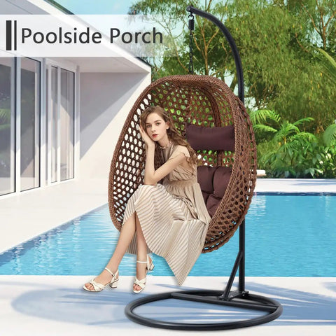 Egg Chair With Stand For Indoor And Outdoor Relaxation by pool, brown wicker, thick cushion, girl seated, tropical background.