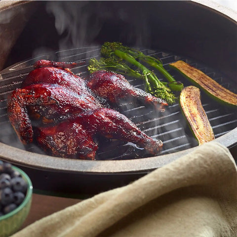 Grill Game Strong 13 Inch Cast Iron Cookin Grid For S And MiniMax Big Green Egg with grilled chicken and vegetables.