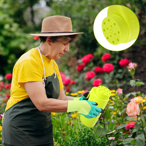 Gardener using Handheld Lawn Spreader Kit For Grass Seed Fertilizer Ice Melt And Sand Includes Scoop And Gloves Portable Yard Spreader With Adjustable Flow And Twelve Hole Settings Two Liter Capacity Green in a rose garden