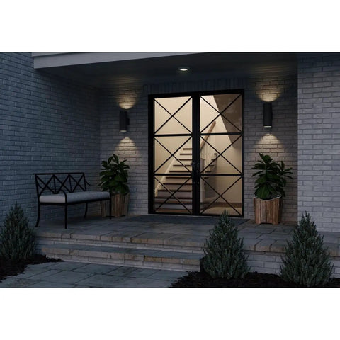 Dope Modern 5 Inch Outdoor Up And Down Wall Lantern In Black Finish Cylinder Collection Exterior Light illuminating entryway at night