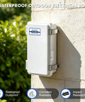 IP67 Weatherproof Electrical Junction Box Outdoor Enclosure Rugged Grey ABS Plastic With Hinged Lid, Mounting Plate And Wall Brackets, Dustproof Waterproof Project Box For Outdoor Electrical Setup. Wall-mounted white ABS IP67 junction box with hinged lid on concrete surface.