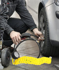 Top Tier Yellow PU Coil Air Hose With Quick Lock Connector For Air Compressor And Pneumatic Tools delivering durability while inflating a tire.