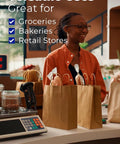 Heavy Duty Kraft Paper Bags With Handles 10 x 7 x 12 Inches, 250 Pack on store counter, ideal for grocery, bakery, retail.