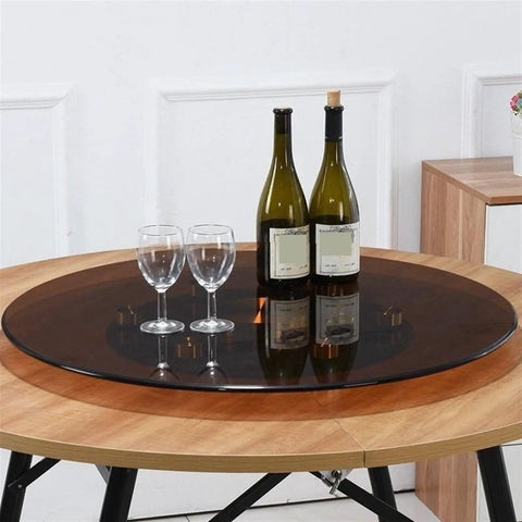 Rotating Serving Tray With Steel Base 360 Degree Turntable on dining table with wine bottles and glasses