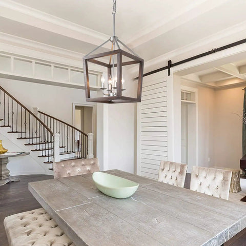 Oak Wood Farmhouse Lantern Pendant Light With Silver Metal Finish hanging above a rustic dining table, open geometric frame chandelier.