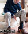Elderly man using Magnetic Flashlight Pickup Tool With LED Telescoping Magnet Gadget In Red to pick up keys from floor