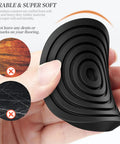 Hand holding No Slip Two And A Half Inch Furniture Coasters Caster Cups Four Pack Rubber Floor Pads Protect Hardwood Floors And Furniture Legs Soft Touch Leg Protectors For All Sizes Of Furniture Black