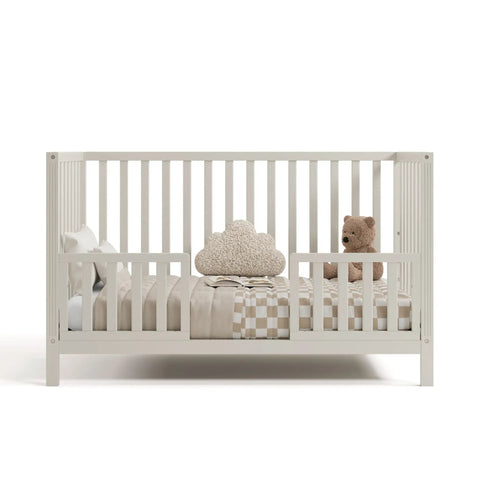 Front view of crib with Storkcraft Toddler Safety Guardrail Kit With Slats In Frosted Oat Finish Dual Guard Rails For Crib To Toddler Bed