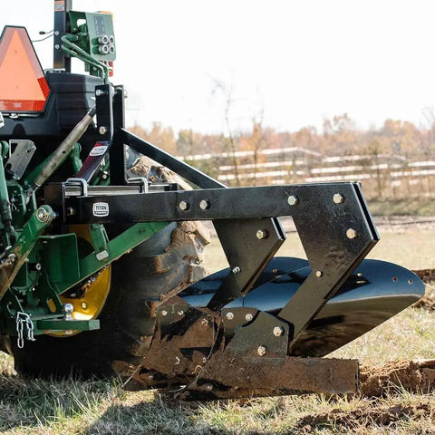 Three Point 21 Inch Double Moldboard Turn Plow For Category 1 Tractors towing in a farm field