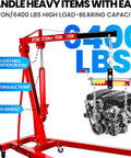 Built Tough Folding Engine Hoist With Quick Adjust Leveler And Rock Solid 6400 Lbs Alloy Steel Capacity Pro Shop Ready Essential For No Sweat Automotive Repair Jobs with adjustable boom and 6400 lbs capacity.