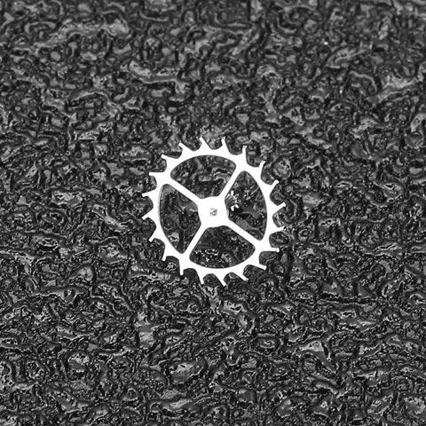 Escape Wheel Replacement Part for ETA 2824-2 2836-2 2834 Movements on textured background